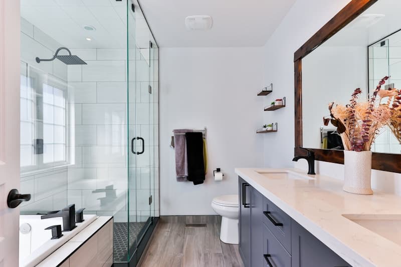 Hotel bathroom with a deep soaking tub and warm finishes